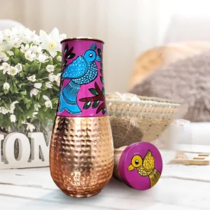 hand-painted fish design hammered copper surahi from Dirums on a bedside table